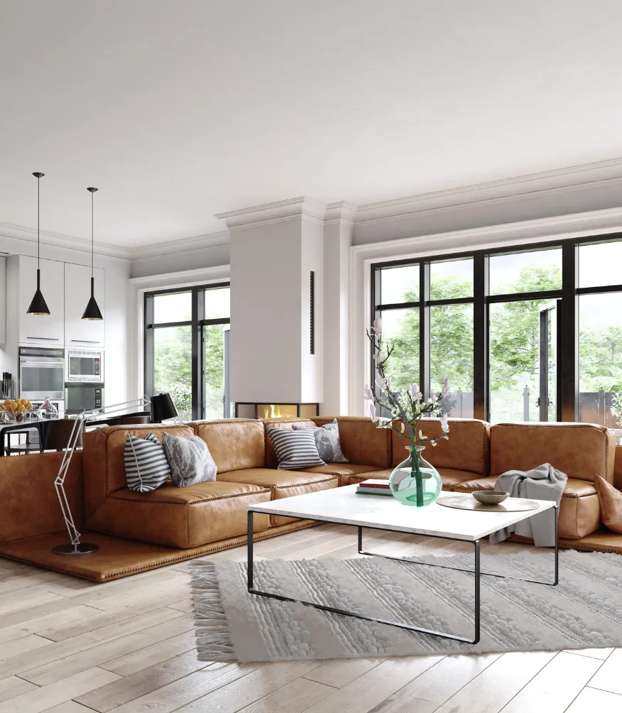 Home remodeling project in Los Angeles featuring an open concept living room with large windows, modern kitchen connection, leather sectional sofa, fireplace, and bright interior renovation