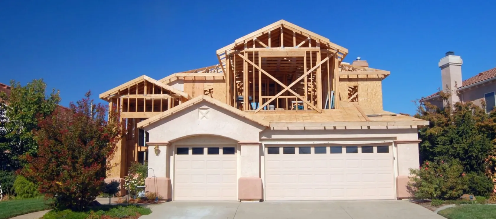 Home addition contractor in Los Angeles building a second story expansion with structural wood framing above an existing residential property